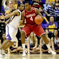 Arkansas' Devonta Abron (4) works the ball against LSU's Storm Warren during an NCAA college basketb...