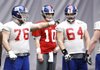 Former Arkansas linemen Tony Ugoh (70) and Mitch Petrus (62) work with other New York Giants linemen and quarterback Eli Manning during practice Friday. Ugoh and Petrus expect to see playing time today when the Giants meet the New England Patriots in the Super Bowl. 