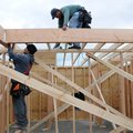 Rodrigo Lopez, top, and Jose Ramos from Cox Development work on a house Tuesday at 3735 Rock Springs...