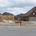 Workers from Cox Development frame a house Tuesday at 3735 Rock Springs St. in Springdale.
