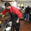 Rigo Ayala, sous chef at Sabores Mexican Cuisine, prepares lunch for a customer Wednesday at the new...