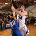 Tyler McCullough, right, a Fayetteville junior, takes a shot in the lane over Rogers senior guard Ca...