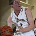 Corbin Copeland, Bentonville, tries to get rid of the ball under the basket Friday while hosting For...