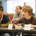 Alex Mueller, right, a Ramay Junior High School quiz bowl team spokesman gives an answer while seate...