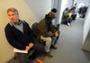 Wayne Rutherford of Bella Vista waits to meet with a clerk Wednesday on the first day of Crisis Program assistance at the Office of Human Concern in Rogers. Rutherford, 64, who is disabled and suffers from colon cancer and a heart condition, lives on $1,300 a month. He said he has used the program’s assistance for the past seven years to help offset the cost of the propane he needs to heat his 
