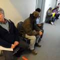 Wayne Rutherford of Bella Vista waits to meet with a clerk Wednesday on the first day of Crisis Prog...