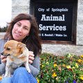 Rhonda DiBasilio, Springdale’s new animal control director, sits outside the shelter with one of the...