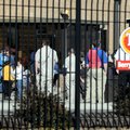 Employees of the Tyson Berry Street Plant wait to return to work after an ammonia leak evacuated the...