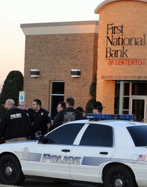 Law enforcement officials from Centerton Police Department, Bella Vista Police Department, Benton County Sheriff’s Office and the Lowell Police Department were at the First National Bank of Centerton for a report of a bank robbery Monday.