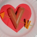 Puppy Love, a simple and inexpensive treat for children on Valentine’s Day, is a hot dog cut into a ...