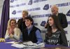 Colton Cheek, center, a Fayetteville boys’ tennis player, signs his national letter of intent with John Brown University on Tuesday at Fayetteville High School. Joining him at the table are, from left, mother Kelly Cheek, grandmother Norma Kerby, sister Karis Cheek, 13, and grandfather Ken Kerby.