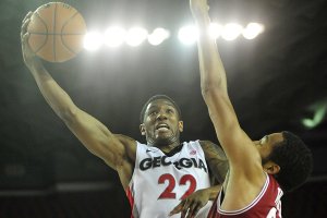 Georgia guard Gerald Robinson (22) shoots over Arkansas forward Marvell Waithe (22) during the second half of an NCAA college basketball game, Wednesday, Feb. 8, 2012, in Athens, Ga. 