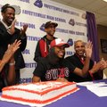 Sydney Conley, center, a Fayetteville standout, smiles Wednesday after signing a letter of intent to...