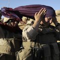 In this Aug. 10, 2009 file photo, U.S. Marine Sgt. Monica Perez, of San Diego, left, helps Lance Cpl...