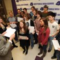 Steve Jacoby, left, Fayetteville High School principal, hands out certificates Thursday to students ...
