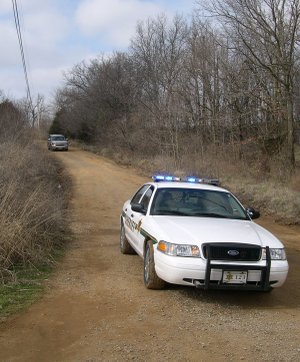 A Washington County Sheriff’s Office patrol car blocks a portion of Smokey Lane near Greenland on Thursday as emergency personnel were called about a man barricading himself in his home.
