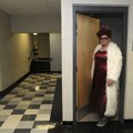 DUDE LOOKS LIKE A LADY Nathan Mabry, 16, a sophomore at Heritage High School in Rogers, comes out of...