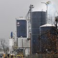 Smoke is seen Friday coming from the top of one of the silos at the AERT plant in Springdale.
