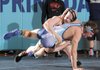 Andy McDowell, top, Bentonville, and Springdale Har-Ber’s Luke Hanson compete in the championship bout for the 170-pound division Saturday during the 7A-West Conference wrestling meet at Har-Ber High School in Springdale.
