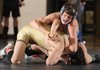 Dylan Collins, right, of Springdale Har-Ber and Bentonville’s Tony Ellis compete in the championship bout for the 113-pound division Feb. 4 during the 7A-West Conference wrestling meet at Har-Ber High School in Springdale.