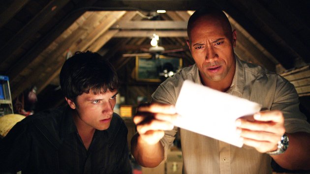 vernian-sean-josh-hutcherson-and-his-stepfather-hank-dwayne-johnson-pore-over-clues-in-the-family-adventure-journey-2-the-mysterious-island