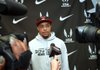 Arkansas Democrat-Gazette/MICHAEL WOODS --02/10/2012-- Former University of Arkansas Athlete Wallace Spearmon talks to reporters Friday afternoon at the 2012 Tyson Invitational indoor Track and Field meet at the Randal Tyson Track Complex in Fayetteville.  