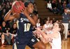Cameron Harris, left, a Shiloh Christian Lady Saints guard, grabs a rebound while guarded by the Gravette’s Whitney Dewitt in Gravette on Friday.
