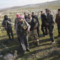 Syrian rebels are seen outside of Idlib, Syria, Saturday, Feb. 11, 2012. 