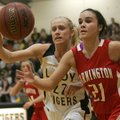 Brooke Barnett, left, a Prairie Grove seior, and Farmington junior Tiffany Rhame chase a loose ball ...