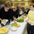 SUPER BOWL PARTY JoAnn Herold, left, and Joan Hiller fix plates of food Feb. 5 as they get ready to ...