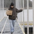 CAREFUL STEPS Tommy Munier watches his step while building a dock with a crew at the Arkansas 12 bri...