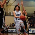 DRIVING THE LANE Jessica Olson, of Springdale Har-Ber, drives for a layup against Bentonville’s Juli...