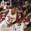 Arkansas' Julysses Nobles (23) drives around South Carolina's R.J. Slawson (33) during the first hal...