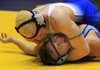 Bryant’s O’Dell Lee (top) pins Springdale Har-Ber’s Nick Smith to win the Class 6A-7A 195-pound title at the state high school wrestling tournament. Lee has only lost three matches in four years. 