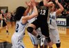 BREAK ON THROUGH Taylor Lee of Bentonville goes up for a shot against Springdale Har-Ber’s Jessica Olson left, Caylee Wright, back, and Samantha Weber during the second half Friday at Wildcat Arena in Springdale.