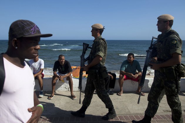 brazilian-army-soldiers-patrol-at-pituacu-beach-in-the-bahian-capital-of-salvador-brazil-friday-feb-10-2012-president-dilma-rousseff-has-offered-help-to-the-governor-of-bahia-where-most-officers-are-returning-to-work-after-an-11-day-strike-during-which-the-capital-citys-murder-rate-doubled