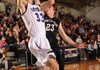 Caleb Waitsman, left, a Fayetteville junior forward, scores past Bentonville senior guard Mason Snow on Tuesday during the first half at Fayetteville High. Go to <a href="http://nwaonline.com/photoreprints">nwaonline.com/photoreprints</a> to see more photos.