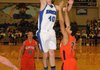 Josh Anderson, of Rogers High, shoots for two points against Rogers Heritage during Tuesday’s game at Kings Arena at Rogers High School.