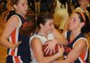 Nicole Scott, a Rogers High guard, competes with Heritage guard Gina Britton, right, for control of a rebound during Wednesday’s game at Kings Arena at Rogers High School.