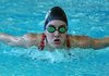 Laura Worthen of Springdale competes in the 100-yard butterfly Wednesday at the Jones Center in Springdale during the North District Swim and Dive Championships.