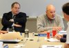 Mick Wagner, right, Northwest Arkansas Conservation Authority chairman, and vice chairman George Spence recommend to move the board into executive session Thursday during a meeting in Highfill.
