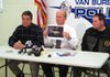 Van Buren Police Chief Kenneth Bell, center, holds up a picture of a pickup belonging to Lloyd Jones of Lavaca, a registered sex offender who was arrested Thursday in the disappearance of  16-year-old Angela Allen.