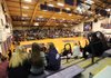 Students, from left, Baylor Griswold, 13; Courtney Soulsby, 13; and Alex Smith, 12, talk Tuesday while watching a Fayetteville High School girls basketball game in Bulldog Gymnasium. The gym will be torn down at the end of the basketball season after 60 years of use.
