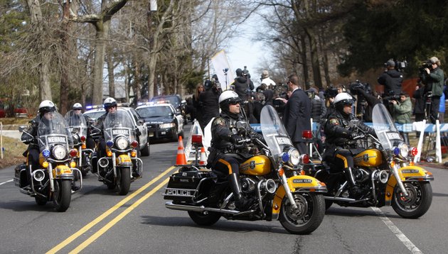 a-newark-police-department-motorcade-escorting-the-hearse-carrying-the-body-of-whitney-houston-arrives-at-fairview-cemetery-for-her-burial-in-westfield-nj-sunday-feb-19-2012
