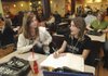 Halea Jacobi, left, and sister Chelsea Jacobi study a pre-algebra lesson together in the student center Thursday at NorthWest Arkansas Community College in Bentonville. Halea Jacobi said even if tuition is raised, NWACC is a good value compared with other colleges.