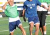 Miguel Gomez, left, sophomore at Springdale Har-Ber High School, and Central Junior High School ninth-grader Rolando Sidon, center, chase after the ball during practice Thursday at Springdale Har-Ber High School.