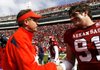 
UA vs Auburn football
Auburn offensive coordinator Gus Malzahn (left) talks with Arkansas defensive lineman Jake Bequette following the Razorbacks' 44-23 win Saturday at Razorback Stadium in Fayetteville.
