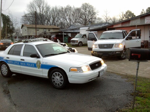 police-cars-surround-an-suv-on-wednesday-feb-22-2012
