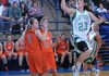 Jessica Casey, left, and Libby Nepivoda, second from left, of Lamar High School watch as Greenland’s Caitlyn Johnson shoots a basket during Thursday’s game at Cedarville High School in the 3A Region 1 Tournament. Greenland beat the Lamar 55-38. For more photos from Thursday’s game, visit photos.nwaonline.com.