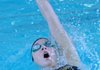 Lauren Tininenko of Bentonville competes in the 100-yard backstroke Feb. 15 at the Jones Center for the 7A-West Conference Swimming and Diving Meet.
